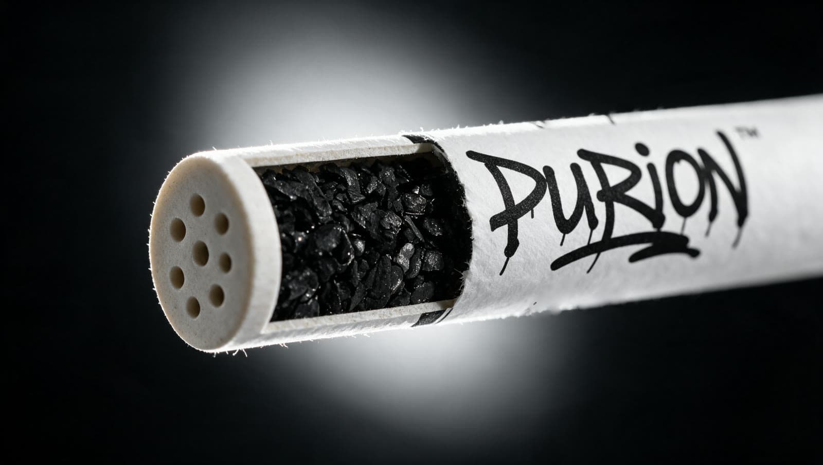 Sección longitudinal de un filtro PURION: tapón cerámico, carbón activado granulado y tapón cerámico